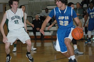 Dennis-Yarmouth's Kenny Dorr guards St. John Paul II's Johnny Warden (22) in Stripes Tourney action Monday night in South Yarmouth. Sean Walsh/www.capecod.com sports