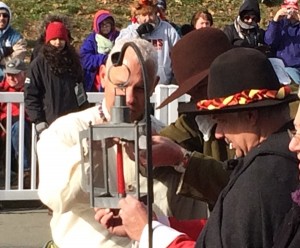 Ceremonial mutual lighting of candle with Wampanoags and "Pilgrims."