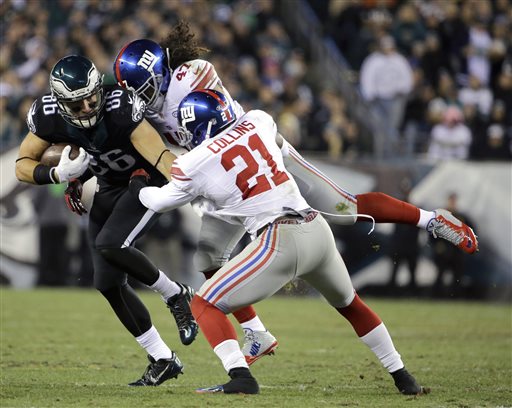 Philadelphia Eagles tight end Zach Ertz (86) is tackled by New York Giants middle linebacker Uani' Unga (47) and free safety Landon Collins (21) during the first half of an NFL football game Monday, Oct. 19, 2015, in Philadelphia. (AP Photo/Matt Rourke)