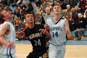 Nauset Warriors' Jackson Hill battles Sandwich's Sam Whittle beneath the basket in the fourth quarter of the Blue Knight's 78-54 victory last night in East Sandwich. Sean Walsh/capecod.com sports