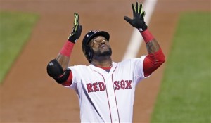 Boston Red Sox designated hitter David Ortiz raises his arms and looks upward as he crosses home plate after a two-run home run during the first inning of a baseball game against the Tampa Bay Rays at Fenway Park in Boston, Thursday, Sept. 24, 2015. (AP Photo/Charles Krupa)