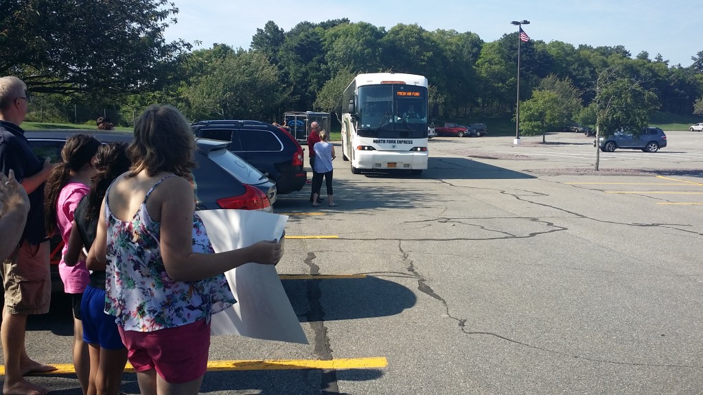 Volunteer host families await the arrival of the bus carrying the children participating in the Fresh Air program.