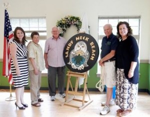 COURTESY TOWN OF BARNSTABLE Barnstable Director of Senior Services Madeline Noonan, Natural Resources Assistant Donna Bragg, woodcarvers Jack Mooney and George Ford, and Assistant Director of Senior Services Donna Burns pose with the new Sandy Neck sign, crafted by the Senior Center Woodcarvers.