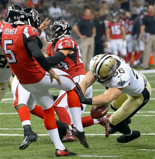New Orleans Saints linebacker Michael Mauti (56) blocks a punt by Atlanta Falcons' Matt Bosher during the first half of an NFL football game, Thursday, Oct. 15, 2015, in New Orleans. The Saints won 31-21. (Matthew Hinton/The Advocate via AP)