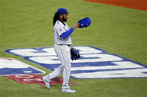 Kansas City Royals starting pitcher Johnny Cueto leaves the game against the Toronto Blue Jays during the third inning in Game 3 of baseball's American League Championship Series on Monday, Oct. 19, 2015, in Toronto. (AP Photo/Paul Sancya)