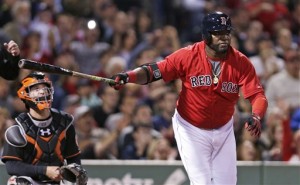 Boston Red Sox designated hitter David Ortiz, right, watches his two RBI double during the sixth inning of a baseball game against the Baltimore Orioles at Fenway Park in Boston, Friday, Sept. 25, 2015. At left is Orioles catcher Caleb Joseph. (AP Photo/Charles Krupa)