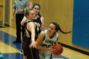 Upper Cape Tech's Alexandra Hill tries to split an Old Colony Voke  double team in last night's 50-39 win for the host Rams. Sean Walsh/Capecod.com Sports