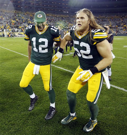 Green Bay Packers' Aaron Rodgers (12) and Clay Matthews celebrate after an NFL football game against the Kansas City Chiefs Monday, Sept. 28, 2015, in Green Bay, Wis. The Packers won 38-28. (AP Photo/Matt Ludtke)