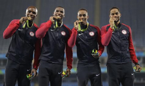 The United States men's 4x400 meter relay team members LaShawn Merritt, Gil Roberts, Tony McQuay and Arman Hall hold their gold medals during an athletics podium ceremony at the Summer Olympics inside Olympic stadium in Rio de Janeiro, Brazil, Saturday, Aug. 20, 2016. (AP Photo/Jae C. Hong)