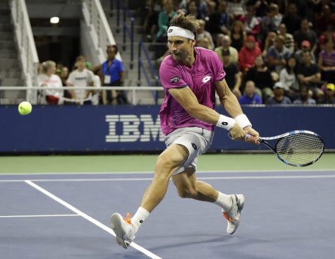 David Ferrer, of Spain, runs down a shot form Fabio Fognini, of Italy, during the U.S. Open tennis tournament, Thursday, Sept. 1, 2016, in New York. (AP Photo/Julio Cortez)