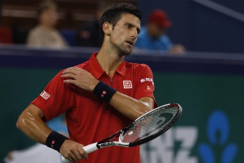 Novak Djokovic of Serbia looks at his opponent Roberto Bautista Agut of Spain during the men's singles semifinals match of the Shanghai Masters tennis tournament at Qizhong Forest Sports City Tennis Center in Shanghai, China, Saturday, Oct. 15, 2016. (AP Photo/Andy Wong)