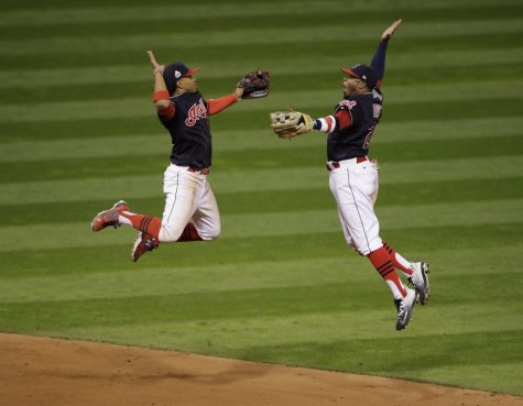 Cleveland Indians' Francisco Lindor and Rajai Davis celebrate after Game 1 of the Major League Baseball World Series against the Chicago Cubs Tuesday, Oct. 25, 2016, in Cleveland. The Indians won 6-0 to take a 1-0 lead in the series.(AP Photo/Gene J. Puskar)