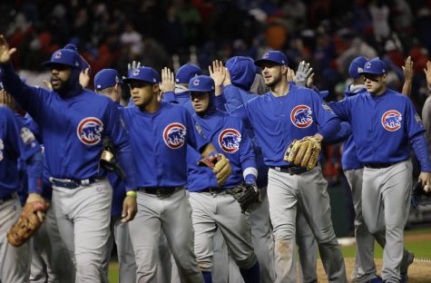 The Chicago Cubs celebrate after Game 2 of the Major League Baseball World Series against the Cleveland Indians Wednesday, Oct. 26, 2016, in Cleveland. The Cubs won 5-1 to tie the series 1-1. (AP Photo/David J. Phillip)