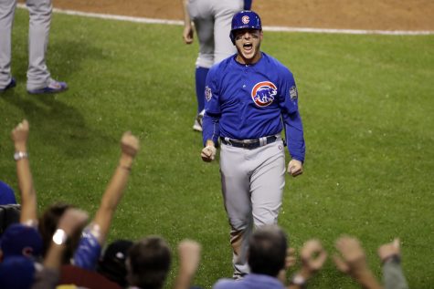 Chicago Cubs' Anthony Rizzo reacts after scoring on a hit by Miguel Montero during the 10th inning of Game 7 of the Major League Baseball World Series against the Cleveland Indians Wednesday, Nov. 2, 2016, in Cleveland.(AP Photo/Gene J. Puskar)