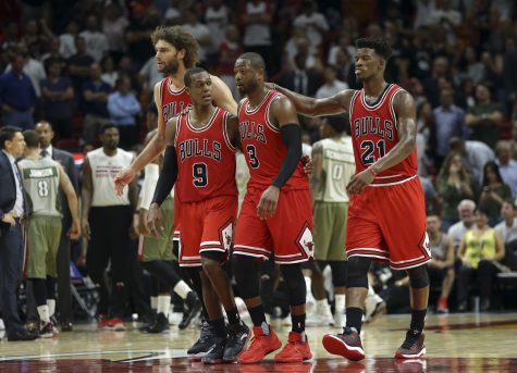 Chicago Bulls' Dwyane Wade (3) walks with Rajon Rondo (9) and Jimmy Butler (21) during a timeout in the second half of an NBA basketball game against the Miami Heat, Thursday, Nov. 10, 2016, in Miami. (AP Photo/Lynne Sladky)