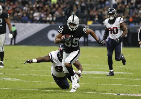 Oakland Raiders wide receiver Amari Cooper breaks away from Houston Texans defensive end D.J. Reader on his way to scoring a touchdown during the second half of an NFL football game Monday, Nov. 21, 2016, in Mexico City. (AP Photo/Eduardo Verdugo)