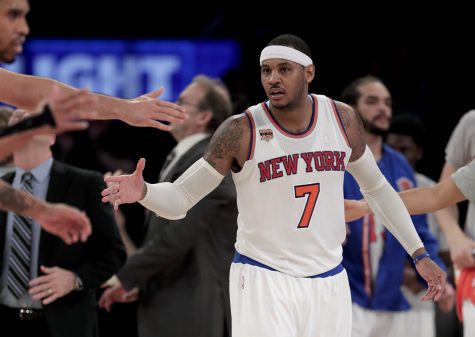 New York Knicks forward Carmelo Anthony (7) is congratulated by teammates after hitting a shot against the Charlotte Hornets during the fourth quarter of an NBA basketball game, Friday, Nov. 25, 2016, in New York. The Knicks won 113-111 in overtime. (AP Photo/Julie Jacobson)