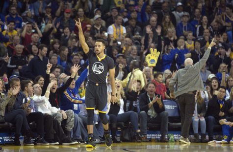 Golden State Warriors' Stephen Curry (30) celebrates his 3-point basket against the Minnesota Timberwolves during the first quarter of an NBA basketball game, Saturday, Nov. 26, 2016 in Oakland, Calif. (AP Photo/D. Ross Cameron)