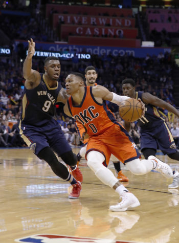 Oklahoma City Thunder guard Russell Westbrook (0) drives to the basket around New Orleans Pelicans forward Terrence Jones (9) during the second half of an NBA basketball game in Oklahoma City, Sunday, Dec. 4, 2016. Oklahoma City won 101-92. (AP Photo/Alonzo Adams)