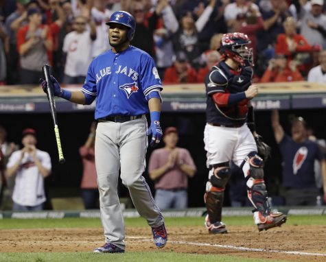 Toronto Blue Jays' Edwin Encarnacion, left, reacts after striking out against the Cleveland Indians during the ninth inning in Game 2 of baseball's American League Championship Series in Cleveland, Saturday, Oct. 15, 2016. (AP Photo/Matt Slocum)