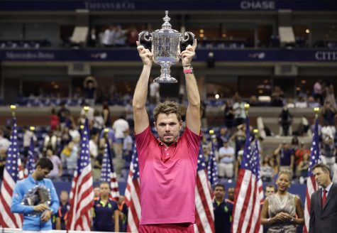 Stan Wawrinka, of Switzerland, holds up the championship trophy after beating Novak Djokovic, of Serbia, to win the men's singles final of the U.S. Open tennis tournament, Sunday, Sept. 11, 2016, in New York.  (AP Photo/Darron Cummings)