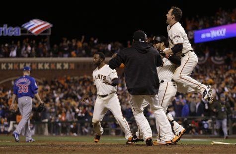San Francisco Giants players celebrate after Joe Panik, not pictured hit a double to score Brandon Crawford during the thirteenth inning of Game 3 of baseball's National League Division Series against the Chicago Cubs in San Francisco, Monday, Oct. 10, 2016. The Giants won 6-5. (AP Photo/Ben Margot)