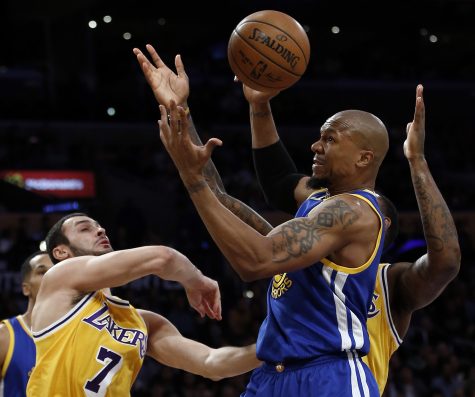 Golden State Warriors forward David West, second from right, competes for a loose ball against Los Angeles Lakers forward Larry Nance Jr., left, and center Tarik Black, right, during the second half of an NBA basketball game in Los Angeles, Friday, Nov. 4, 2016. (AP Photo/Alex Gallardo)