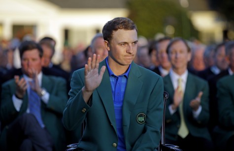 Defending Masters champion Jordan Spieth waves during presentation following the final round of the Masters golf tournament Sunday, April 10, 2016, in Augusta, Ga. (AP Photo/Chris Carlson)