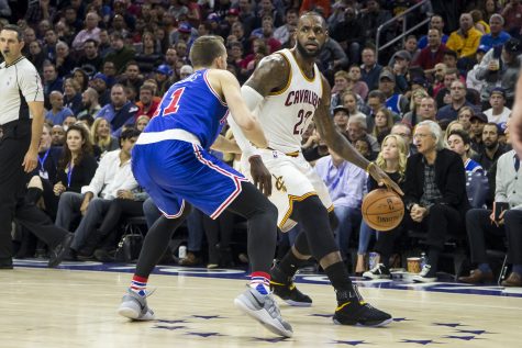 Cleveland Cavaliers' LeBron James, right, in action against Philadelphia 76ers' Nik Stauskas, left, during the first half of an NBA basketball game, Saturday, Nov. 5, 2016, in Philadelphia. The Cavaliers won 102-101. (AP Photo/Chris Szagola)