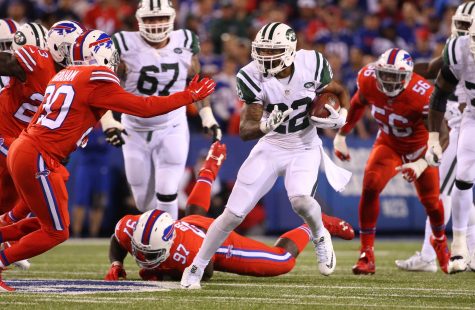 New York Jets running back Matt Forte (22)  runs against Buffalo Bills free safety Corey Graham (20) during the second half an NFL football game on Thursday, Sept. 15, 2016, in Orchard Park, N.Y. (AP Photo/Bill Wippert)