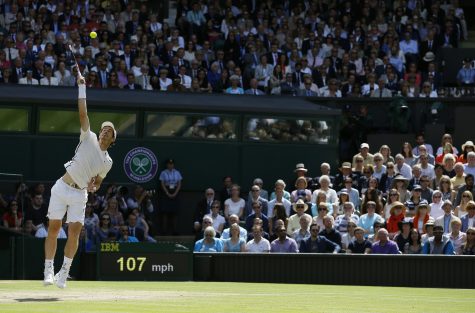 Andy Murray of Britain serves to Milos Raonic of Canada in the men's singles final on day fourteen of the Wimbledon Tennis Championships in London, Sunday, July 10, 2016. (AP Photo/Kirsty Wigglesworth)