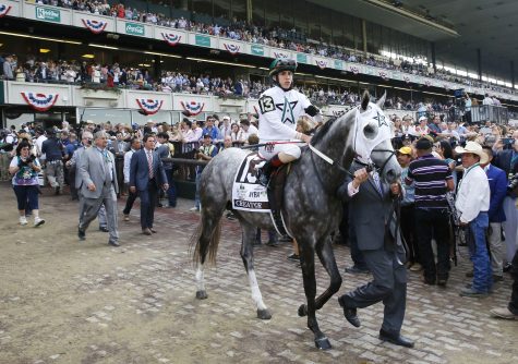 Creator, with jockey Irad Ortiz Jr., is led onto the track for the 148th running of the Belmont Stakes horse race at Belmont Park, Saturday, June 11, 2016, in Elmont, N.Y. Creator won the race. (AP Photo/Kathy Willens)