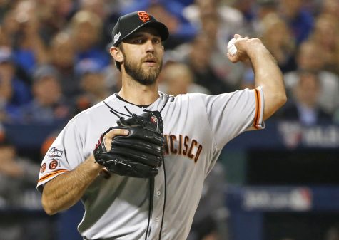 San Francisco Giants starting pitcher Madison Bumgarner (40) throws to first during the first inning of a National League wild-card baseball game against the New York Mets, Wednesday, Oct. 5, 2016, in New York.  (AP Photo/Kathy Willens)