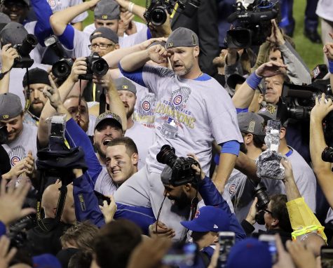 Chicago Cubs' David Ross is carried by teammates after Game 7 of the Major League Baseball World Series against the Cleveland Indians Thursday, Nov. 3, 2016, in Cleveland. The Cubs won 8-7 in 10 innings to win the series 4-3. (AP Photo/Gene J. Puskar)