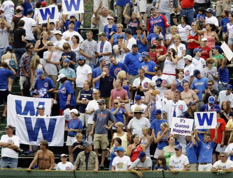 In this Aug. 6, 2008, file photo, Chicago Cubs fans celebrate an 11-4 win over the Houston Astros after a baseball game at Wrigley Field in Chicago. What happens when a lovable loser is no longer a loser? If the Cubs win the World Series for the first time since 1908, what happens to fans who have waited for next year their entire lives? Experts in psychology suggest that Cubs fans will undergo a big change in their identity, which has been shaped by more than a century of falling short of winning the World Series. (AP Photo/Charles Rex Arbogast, File)