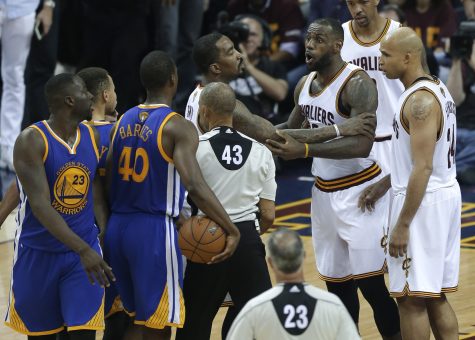 Cleveland Cavaliers forward LeBron James (23) is held back as he argues with Golden State Warriors forward Draymond Green (23) during the second half of Game 4 of basketball's NBA Finals in Cleveland, Friday, June 10, 2016. Golden State won 108-97. (AP Photo/Tony Dejak)