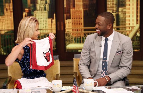 In this image provided by ABC Home Entertainment and TV Distribution, TV host Kelly Ripa and NBA basketball player Dwyane Wade chat during the production of "Live Kelly" in New York, Thursday, July 7, 2016. Wade decided Wednesday night, July 6, 2016, that he will leave the Heat after 13 seasons, agreeing to terms on a two-year-$47 million contract with the Chicago Bulls.(David M. Russell/Disney/ABC Home Entertainment and TV Distribution via AP)