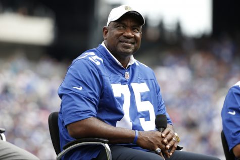 Former New York Giants player George Martin smiles during a halftime ceremony during an NFL football game between the New York Giants and the New Orleans Saints Sunday, Sept. 18, 2016, in East Rutherford, N.J.  (AP Photo/Kathy Willens)