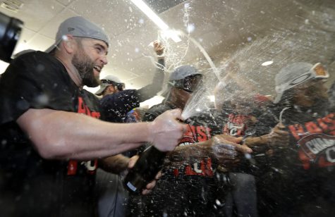 Cleveland Indians first baseman Mike Napoli celebrates in the locker room after their 3-0 win against the Toronto Blue Jays in Game 5 of baseball's American League Championship Series in Toronto, Wednesday, Oct. 19, 2016. The Indians advance to the World Series. (AP Photo/Charlie Riedel)