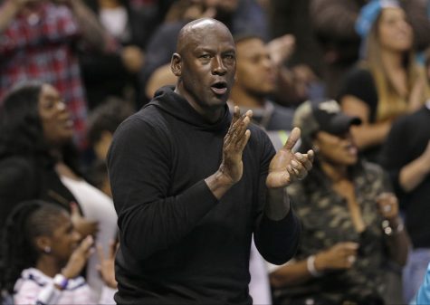 Charlotte Hornets owner Michael Jordan celebrates in the second half of an NBA basketball game against the Washington Wizards  in Charlotte, N.C., Wednesday, Nov. 25, 2015. The Hornets won 101-87. (AP Photo/Chuck Burton)