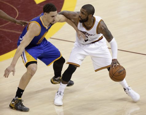 Cleveland Cavaliers guard Kyrie Irving, right, is defended by Golden State Warriors guard Klay Thompson (11) during the second half of Game 6 of basketball's NBA Finals in Cleveland, Thursday, June 16, 2016. (AP Photo/Tony Dejak)