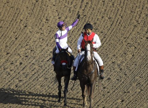 Mario Gutierrez celebrates after riding Nyquist to victory during the 142nd running of the Kentucky Derby horse race at Churchill Downs Saturday, May 7, 2016, in Louisville, Ky. (AP Photo/Charlie Riedel)