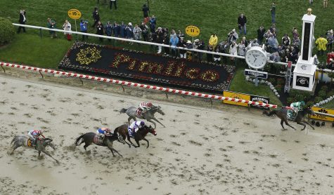 Exaggerator with Kent Desormeaux aboard wins the 141st Preakness Stakes horse race as Cherry Wine (1) with Corey Lanerie atop and Nyquist (3) with Mario Gutierrez aboard come in at Pimlico Race Course, Saturday, May 21, 2016, in Baltimore. (AP Photo/Patrick Semansky)