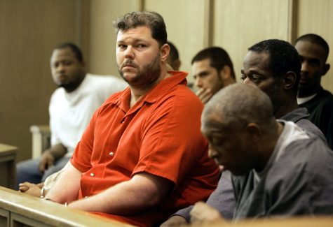 FILE - In this Sept. 23, 2005, file photo, former Oakland Raiders center Barret Robbins, left, awaits a hearing at the Miami-Dade courthouse, in Miami. Surviving the week of lead-up before the Super Bowl proved too challenging for a handful of players including Robbins. Oakland's All-Pro center disappeared the day before the game in 2003 from the team's San Diego hotel and headed to Tijuana, Mexico. He returned that night disoriented, spent game day in the hospital, and his life and career spiraled downward into substance-abuse clinics and jail time. (AP Photo/J. Pat Carter, File)