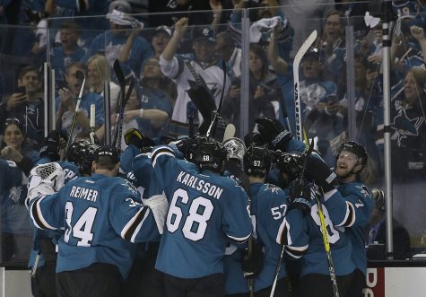 San Jose Sharks players celebrate after Joonas Donskoi scored the winning goal against the Pittsburgh Penguins during overtime of Game 3 of the NHL hockey Stanley Cup Finals in San Jose, Calif., Saturday, June 4, 2016. The Sharks won 3-2. (AP Photo/Marcio Jose Sanchez)