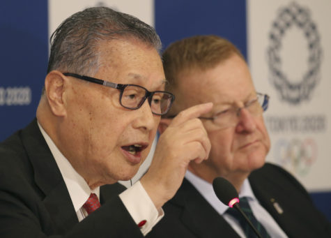 President of the 2020 Tokyo Olympic and Paralympic Organizing Committee, Yoshiko Mori, speaks as IOC Vice President John Coates, right, listens during their joint press conference of the IOC coordination commission in Tokyo, Friday, Dec. 2, 2016. Further efforts to cut costs and the venues for five new sports were the focus of a coordination commission review of the Tokyo Olympics that wrapped up on Friday. Coates led a two-day meetings, held amid concerns about the budget for the 2020 Games. Construction costs have soared in part due to shortages in labor and materials as Japan also continues recovery from the 2011 earthquake and tsunami. (AP Photo/Koji Sasahara)