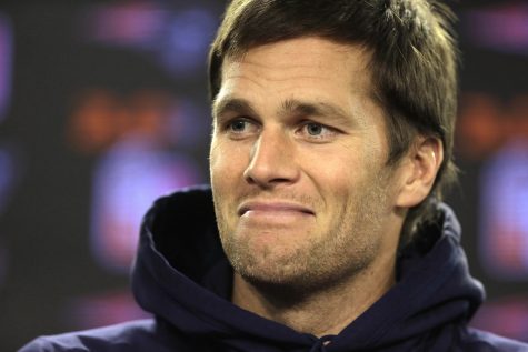 FILE - In this Jan. 6, 2016, file photo, New England Patriots quarterback Tom Brady smiles while facing reporters before a scheduled NFL football practice in Foxborough, Mass. A cookbook offered for $200 on Brady's website has sold out. (AP Photo/Steven Senne, File)