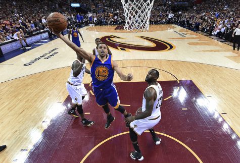Golden State Warriors guard Stephen Curry (30) drives on Cleveland Cavaliers forward LeBron James (23) during the second half of Game 4 of basketball's NBA Finals in Cleveland, Friday, June 10, 2016. Golden State won 108-97. (Bob Donnan/Pool Photo via AP)