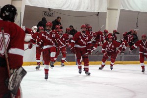 Hingham High celebrates after the final buzzer and races over to back-up goalie Jack Santilli in yesterday's 7-2 win for the Harbormen. Sean Walsh/Capecod.com Sports