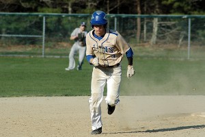 St. John Paul II's Blake Waters takes off running from second base at Lowell Park in Tuesday's 15-4 tilt over Sturgis East. Sean Walsh/Capecod.com Sports